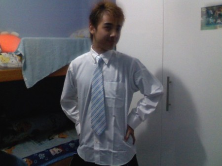 Bao trying his new shirt for graduation